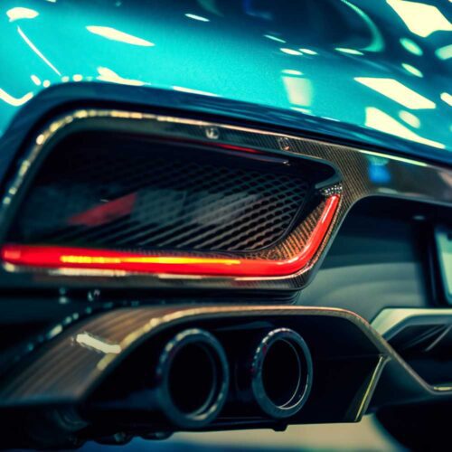 Dual pipe exhaust on a blue car